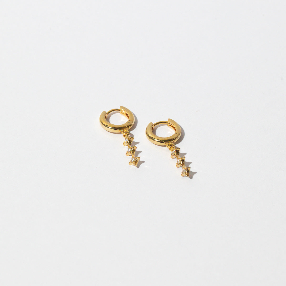 Core Collection SS23 - Cosmic Star Charm Huggies in Gold - Huggies - Astrid &amp; Miyu