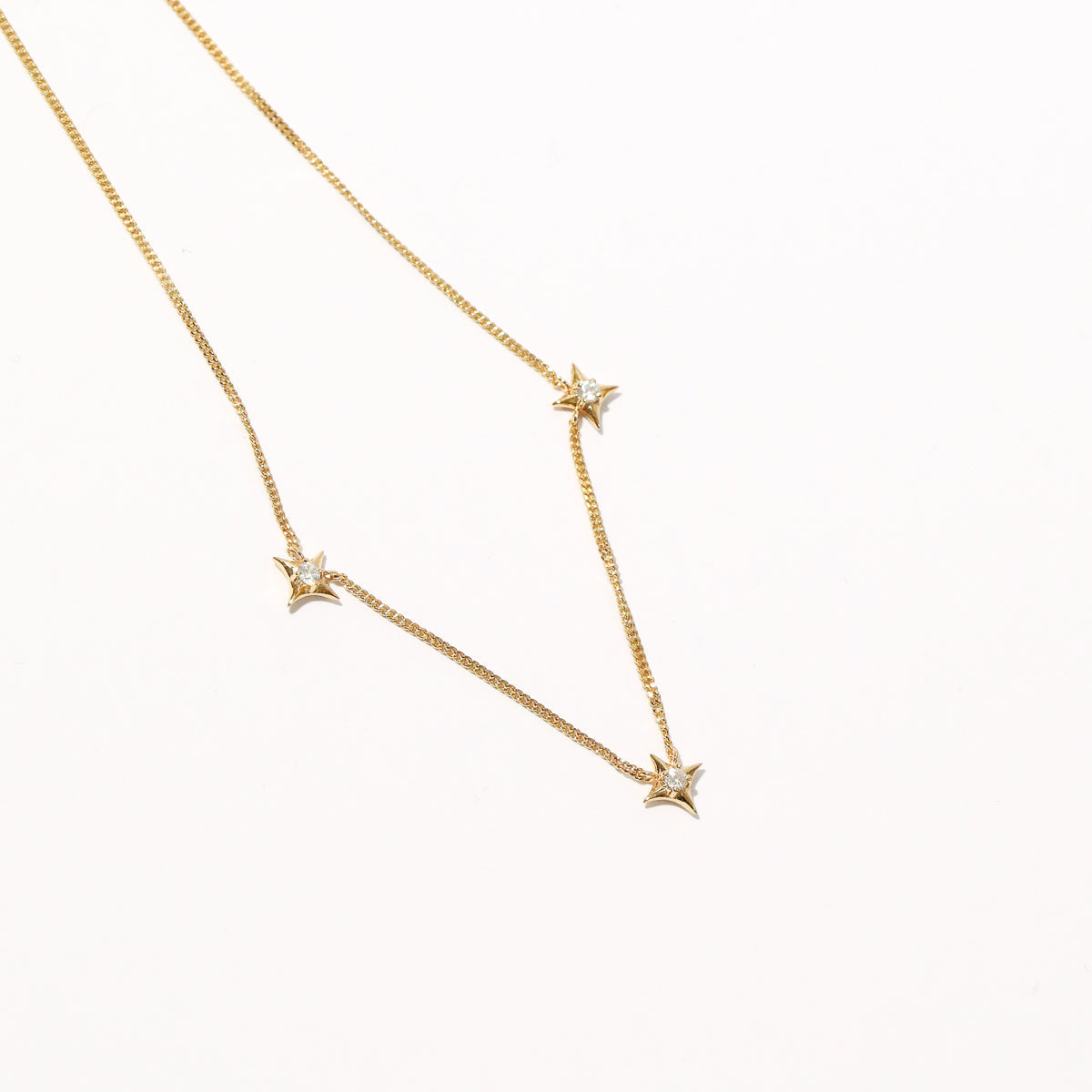 Cosmic Star Charm Necklace in Gold close up shot