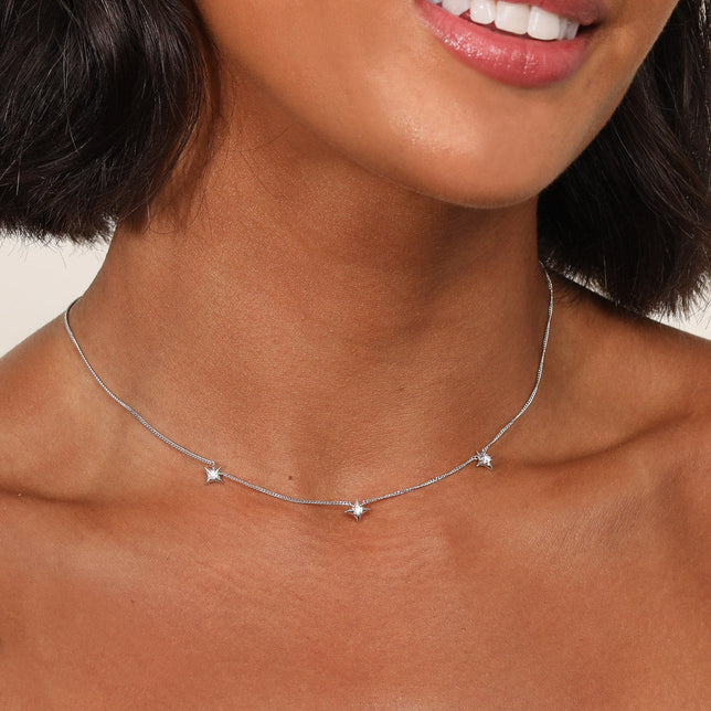 Cosmic Star Charm Necklace in Silver worn