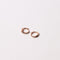 Orbit Crystal Huggies in Rose Gold Flat lay