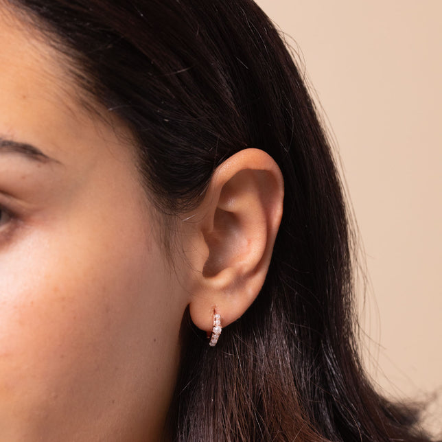 Radiant Pearl Huggies in Rose Gold worn