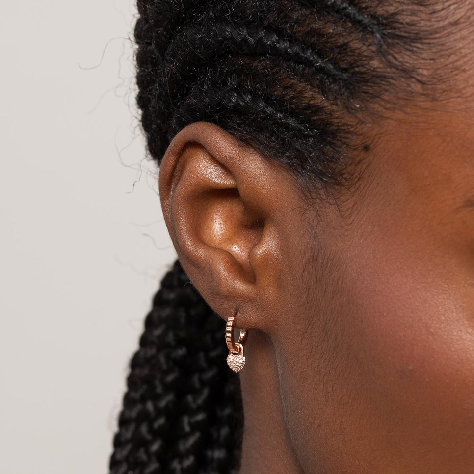 Heart Pave Charm Huggies in Rose Gold worn