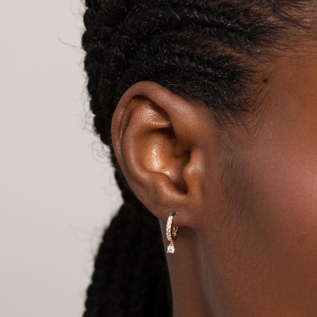 Charm Crystal Huggies in Gold worn