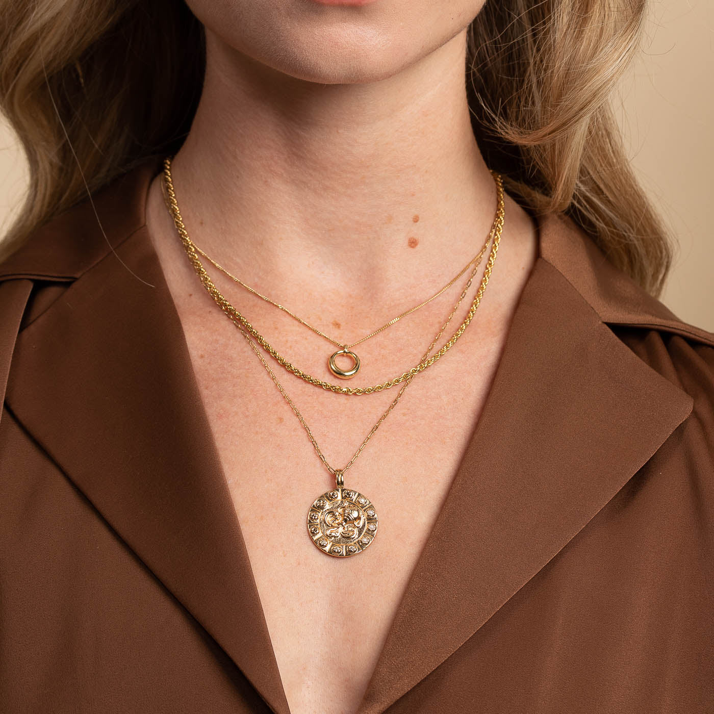 Bold Zodiac Aquarius Pendant Necklace in Gold worn layered with rope chain necklace and bold halo necklace