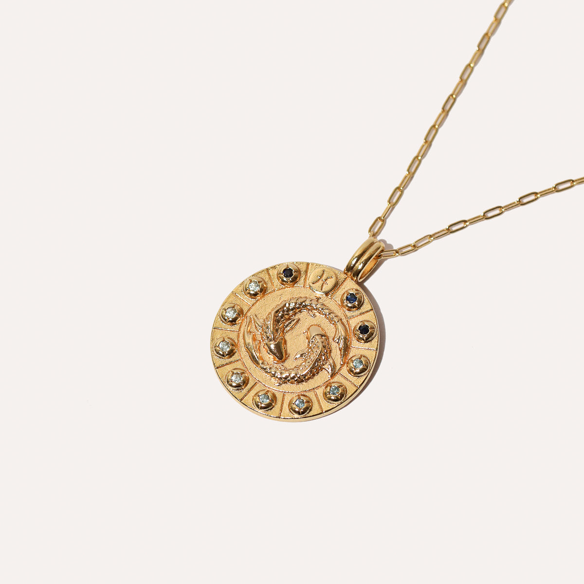 Pisces Bold Zodiac Pendant Necklace in Gold flat lay