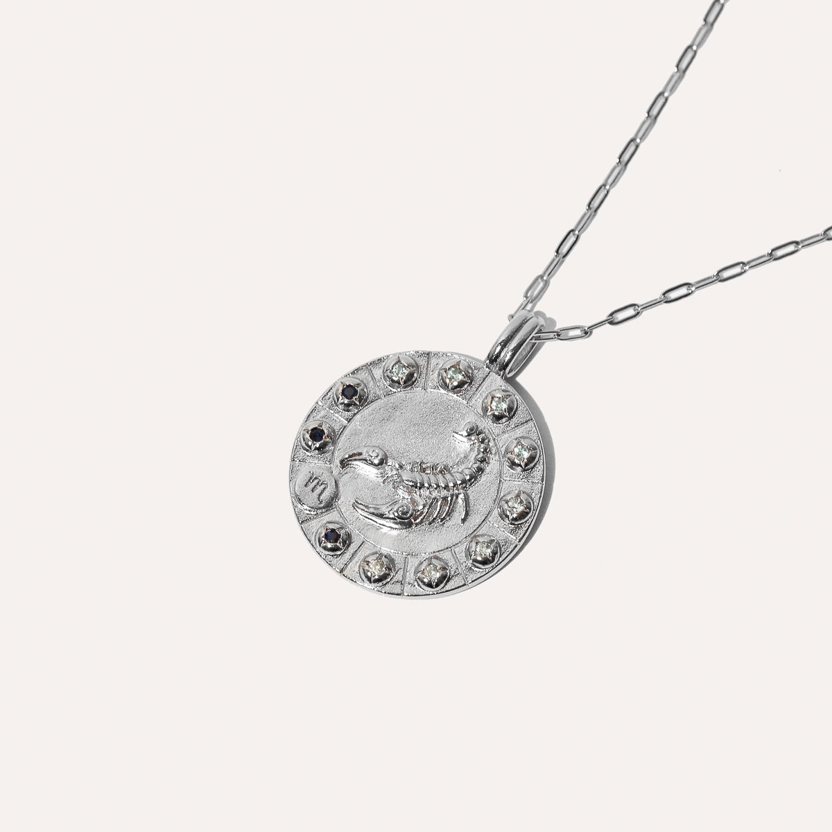 Scorpio Bold Zodiac Pendant Necklace in Silver flat lay