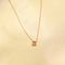 Flat lay shot of B Initial Pendant Necklace in Gold
