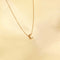 Flat lay shot of C Initial Pendant Necklace in Gold
