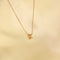 Flat lay shot of K Initial Pendant Necklace in Gold