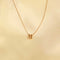 Flat lay shot of U Initial Pendant Necklace in Gold