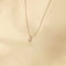 Flat lay shot of J Initial Pendant Necklace in Silver