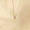Flat lay shot of R Initial Pendant Necklace in Silver