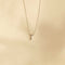 Flat lay shot of T Initial Pendant Necklace in Silver