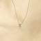 Flat lay shot of X Initial Pendant Necklace in Silver