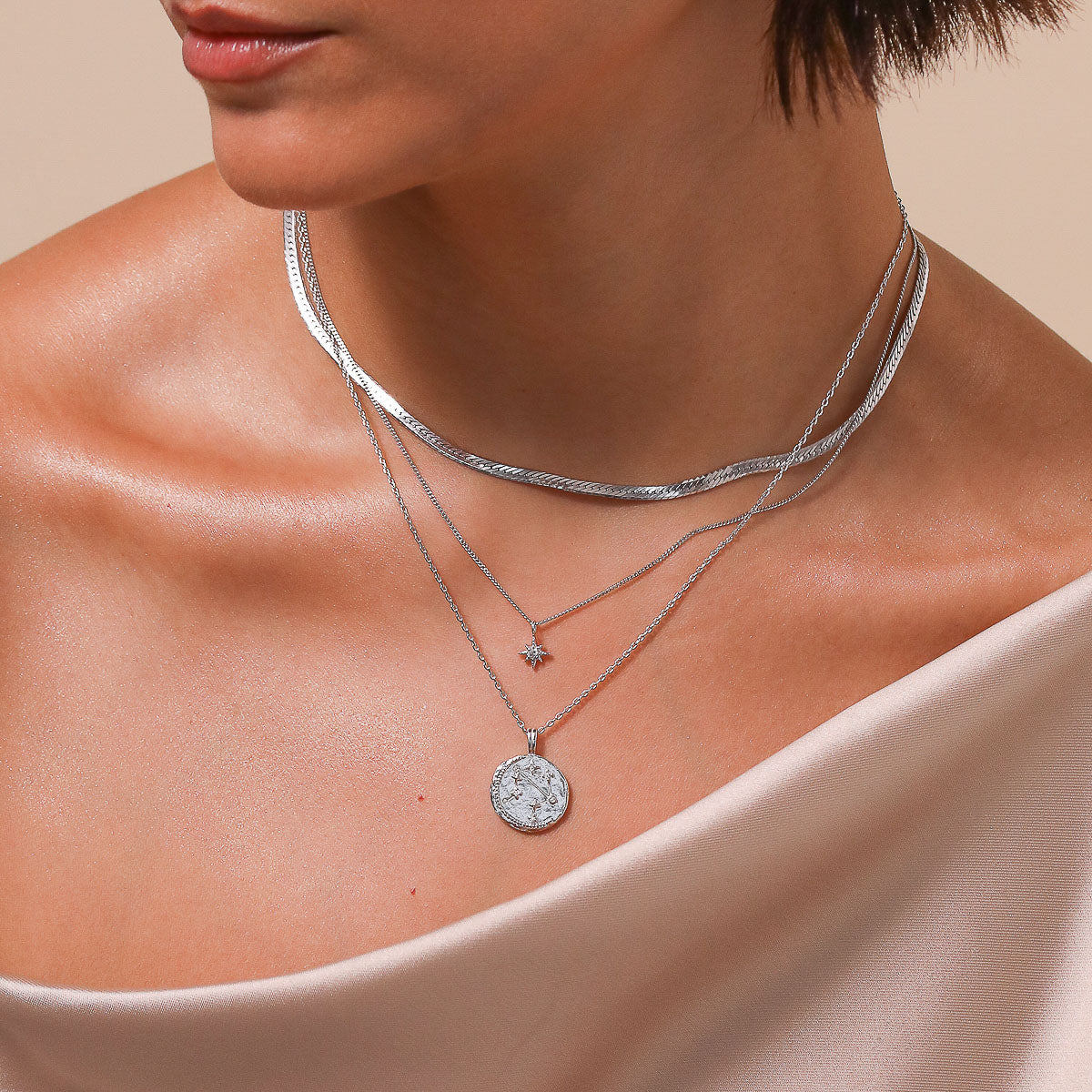 Libra Zodiac Pendant Necklace in Silver worn layered with necklaces