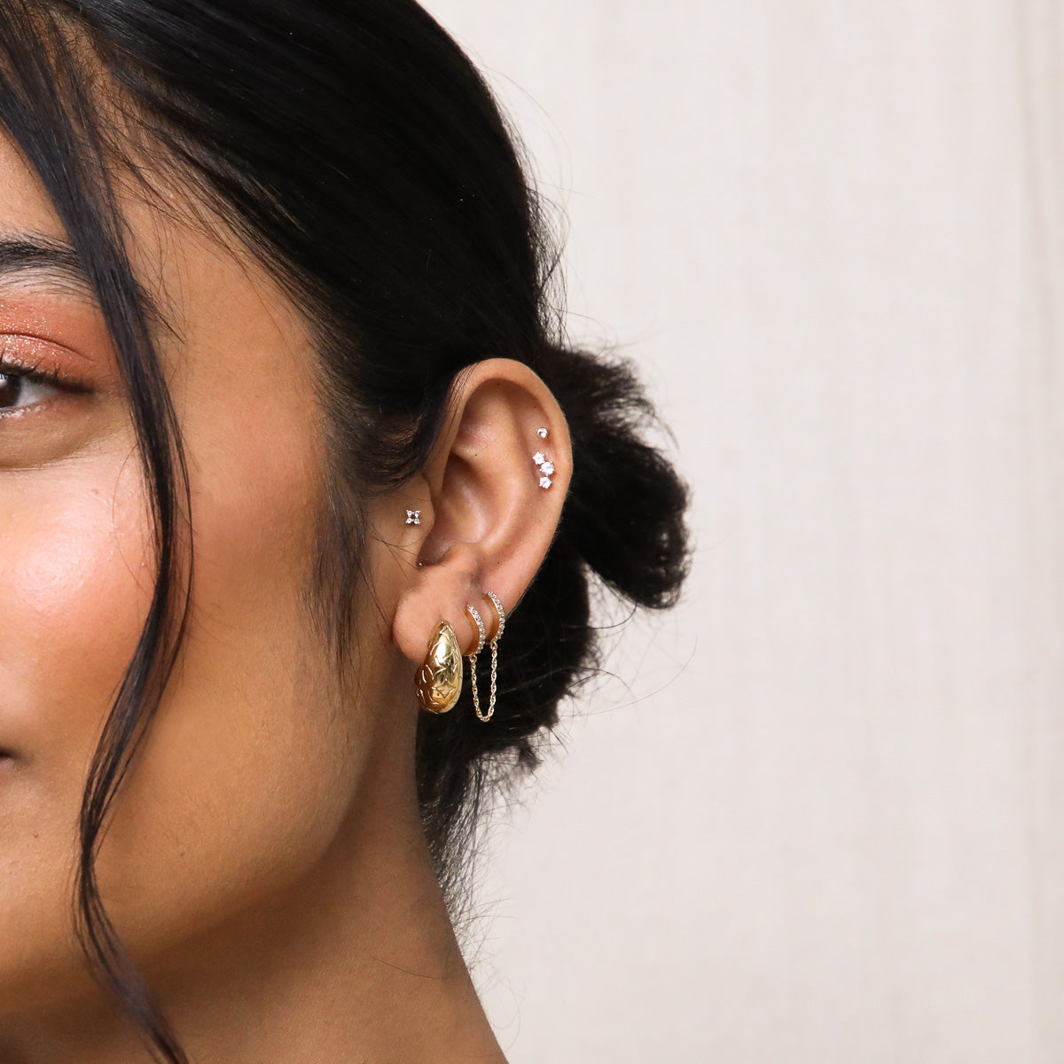 Cosmic Star Large Hoops in Gold worn stacked with other earrings