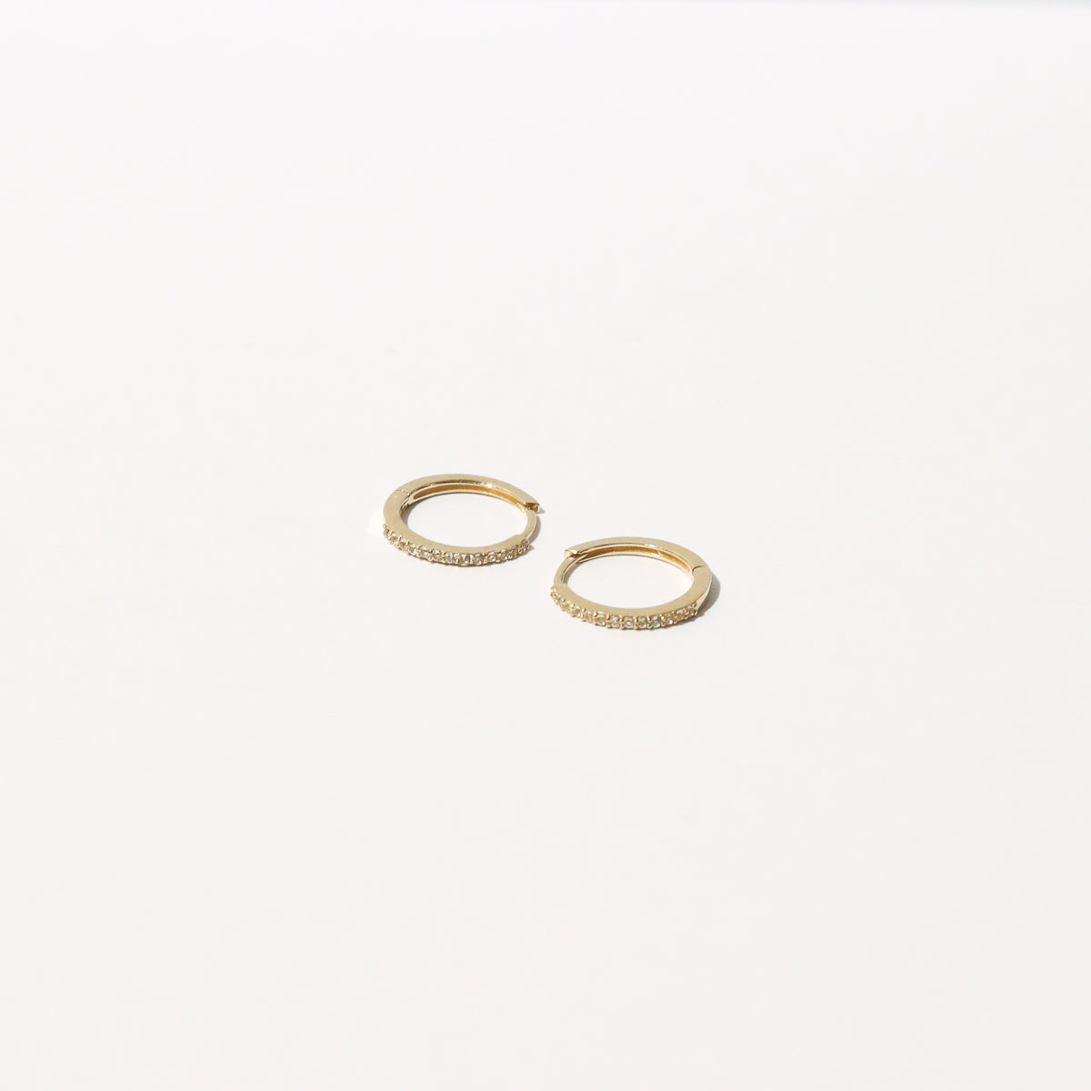 Topaz Hoops in Solid Gold flat lay