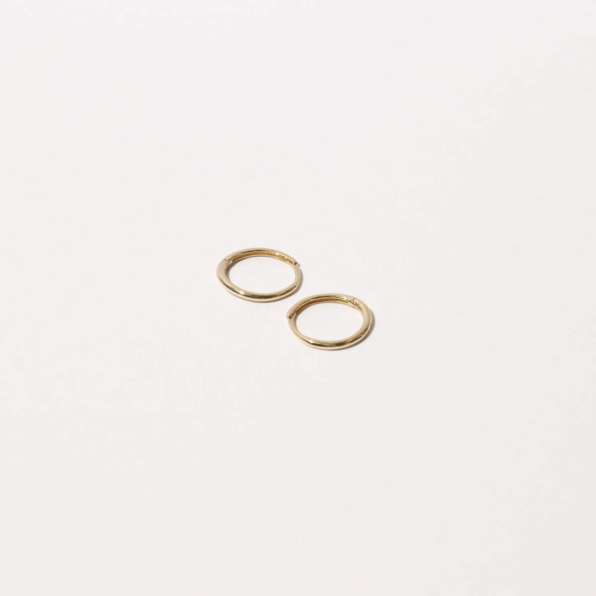 Simple Hoops in Solid Gold flat lay