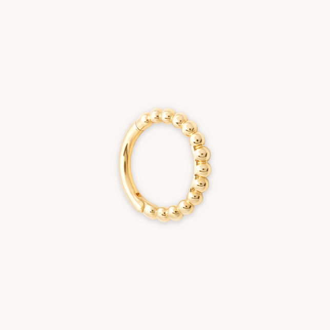 SOLID GOLD BEADED PIERCING HOOP cut out
