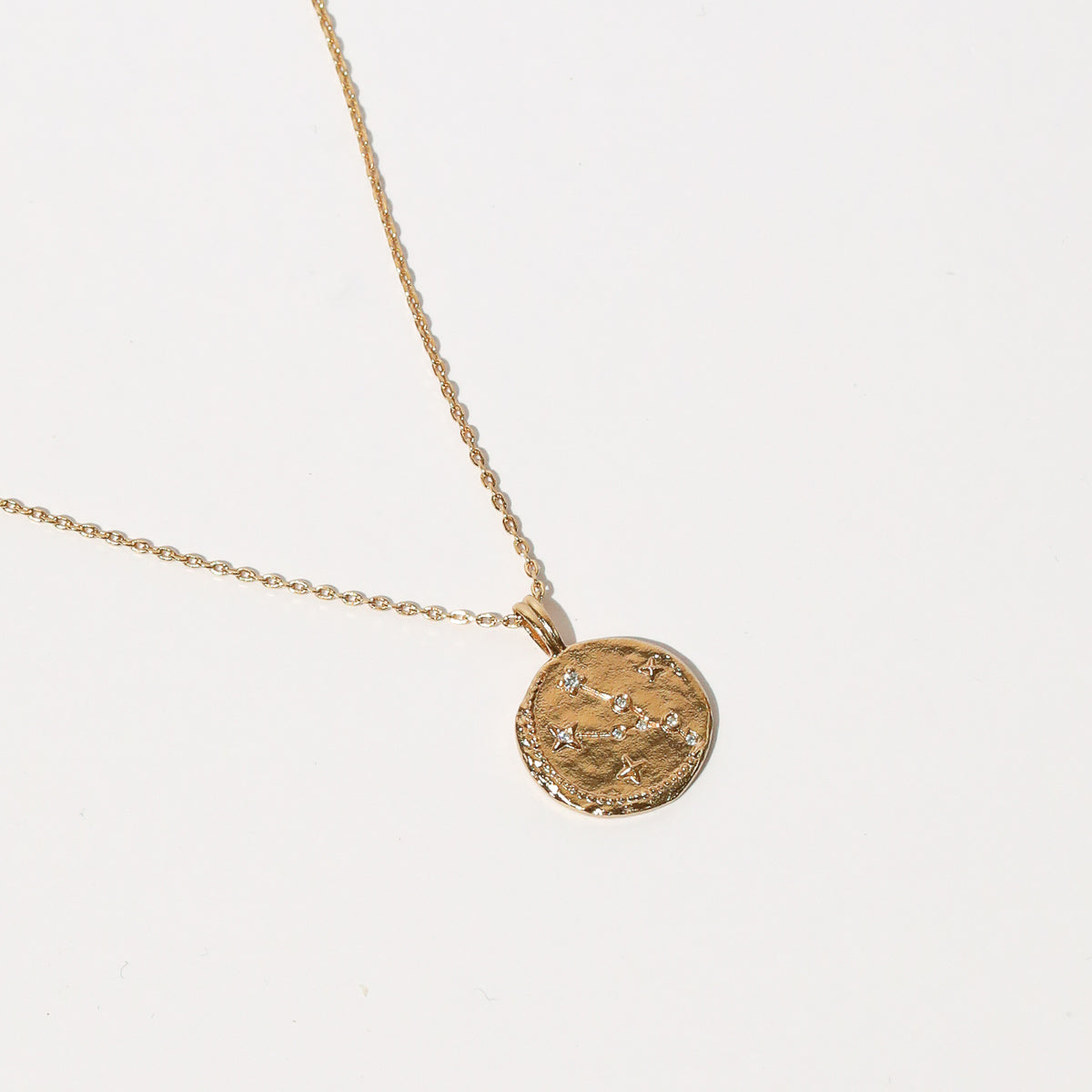 Close up shot of the front of the Taurus Zodiac Pendant Necklace in Gold