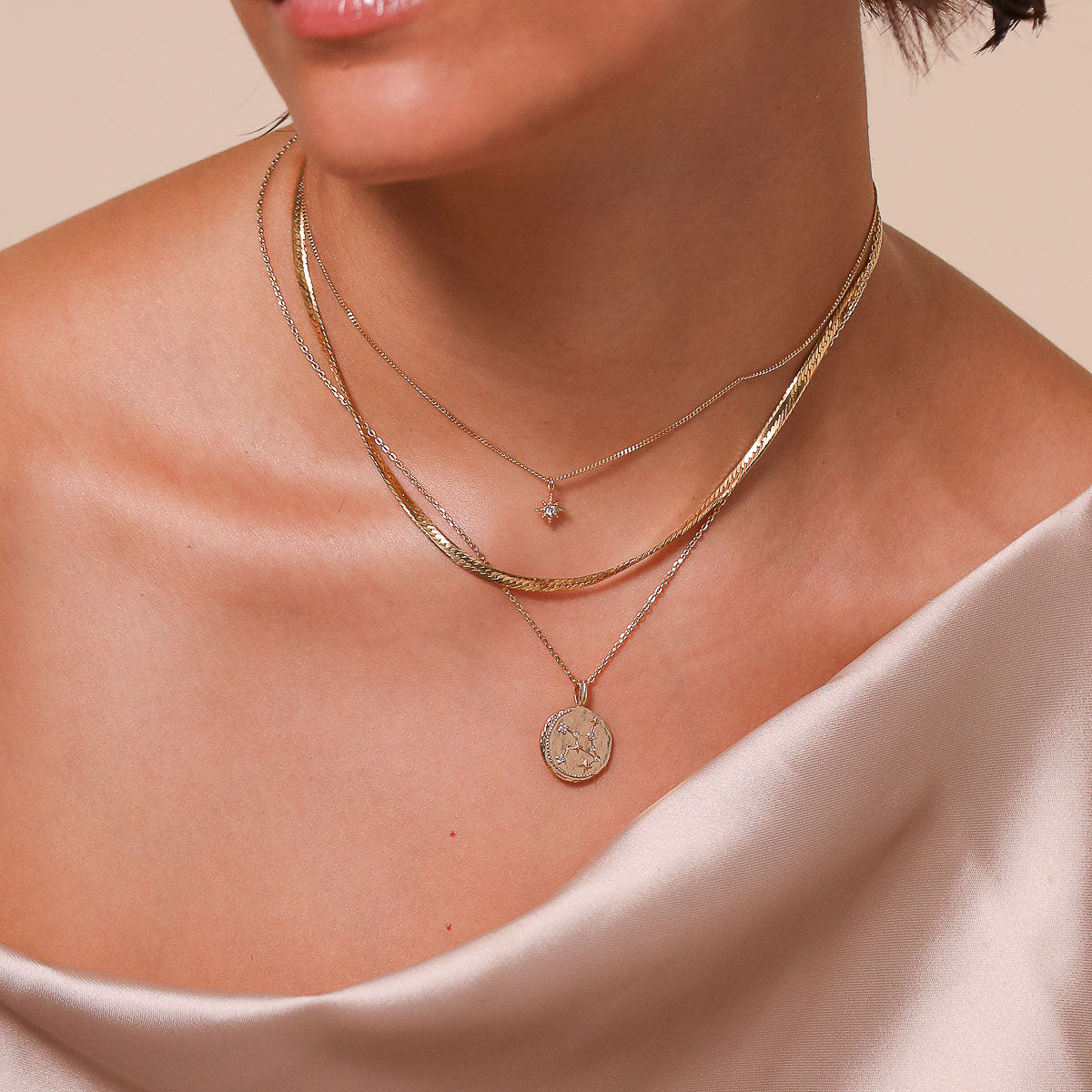 Virgo Zodiac Pendant Necklace in Gold worn layered with necklaces