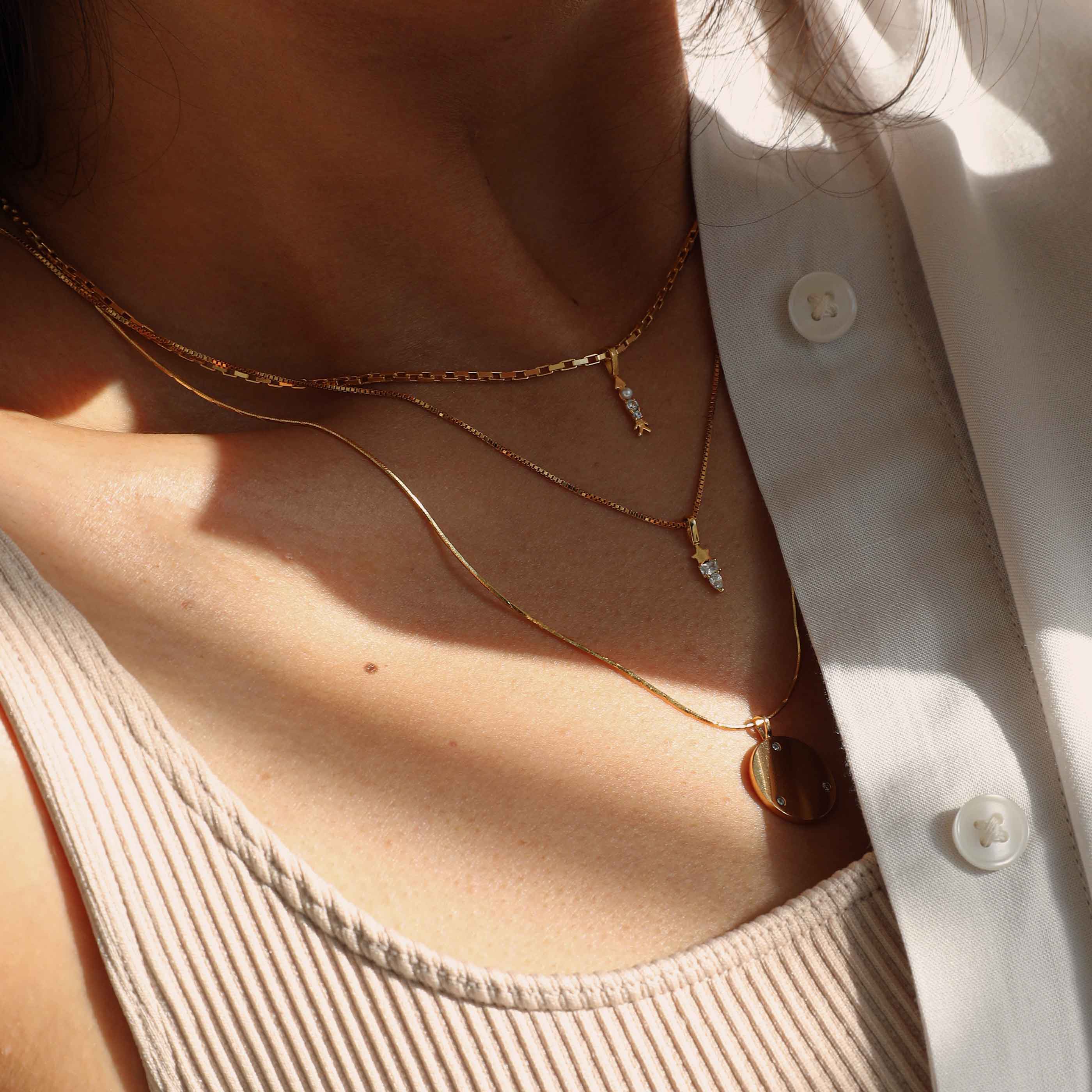 Arrow Necklace Charm in Gold worn on rectangular link chain