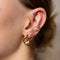 Curved Crystal Barbell in Gold worn with gold ear cuff and gold chunky hoops