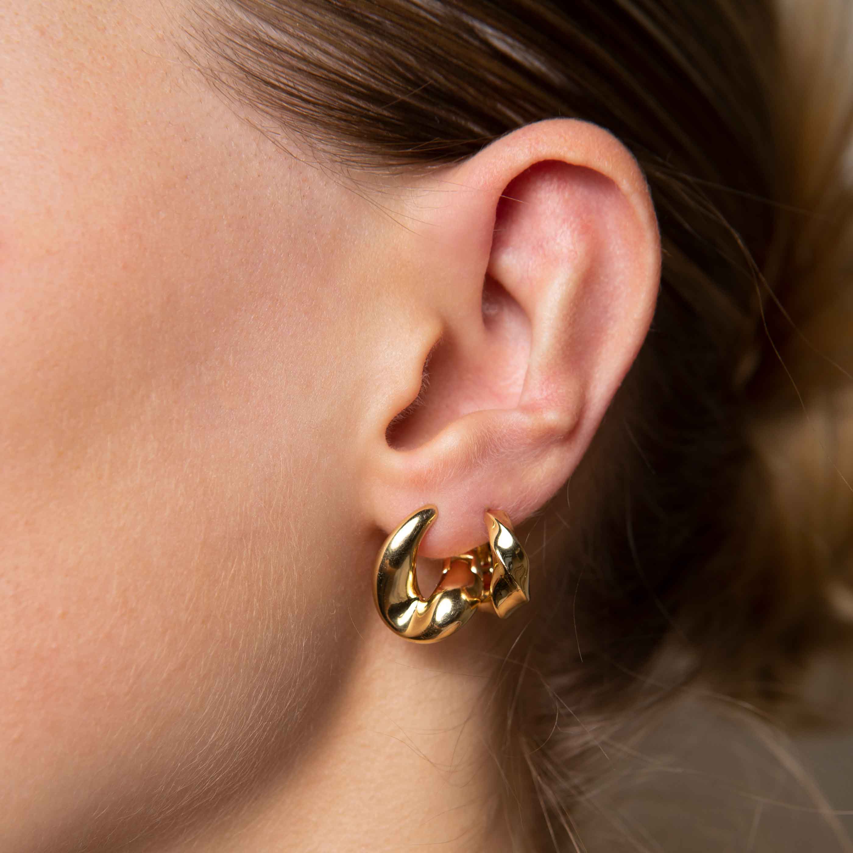 Molten Hoops in Gold worn with elemental hoops